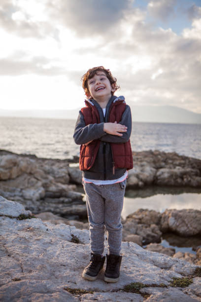 istock Portrait of a laughing little boy 908565108