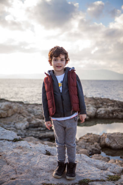istock Portrait of a laughing little boy 908567664