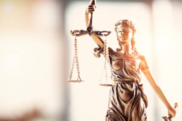 Justice blindfolded lady holding scales and sword statue Justice blindfolded lady holding scales and sword statue bronze statue stock pictures, royalty-free photos & images