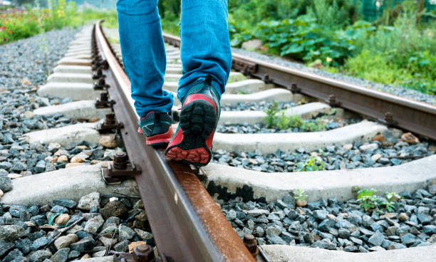 Man walking on railroad track