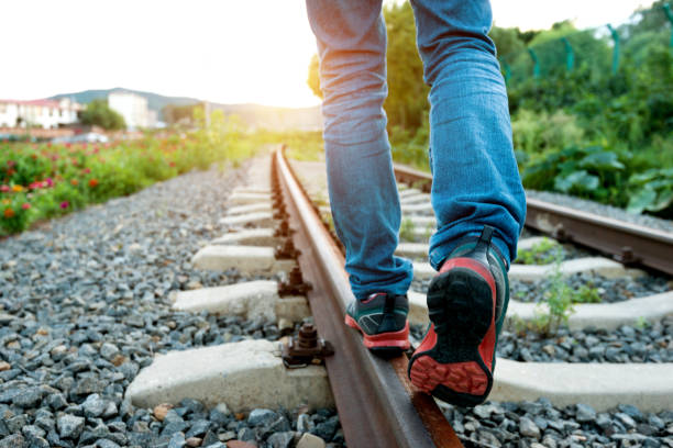 Man walking on railroad track