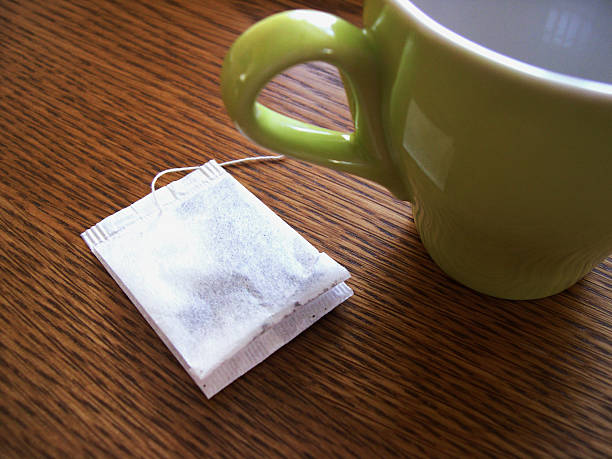 istock Cup and teabag on the wooden table. 90857481