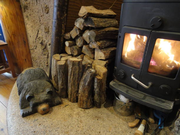 istock Fireplace, with stacks of firewoods 908583212