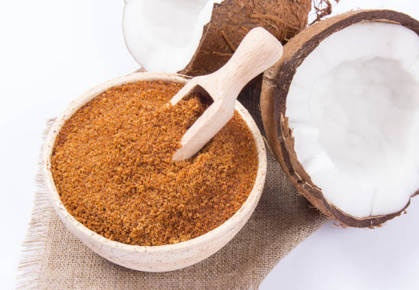 istock Coconut with coconut sugar isolated on white background. 908592928