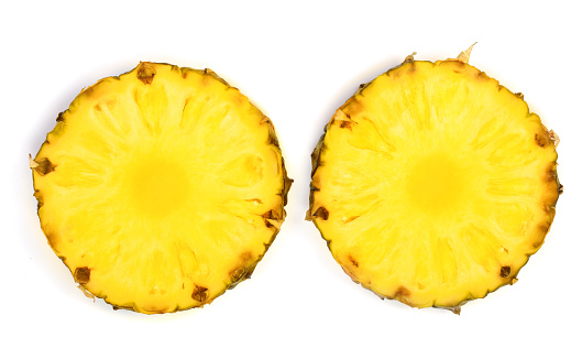 two pineapple slices isolated on white background. Top view. Flat lay.