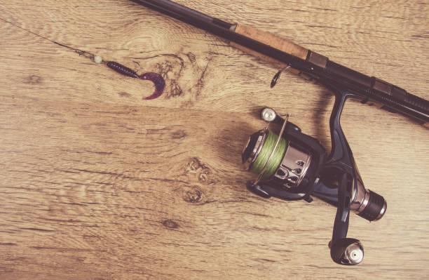 istock Fishing equipment. Spinning method. A place for an inscription. 908596386