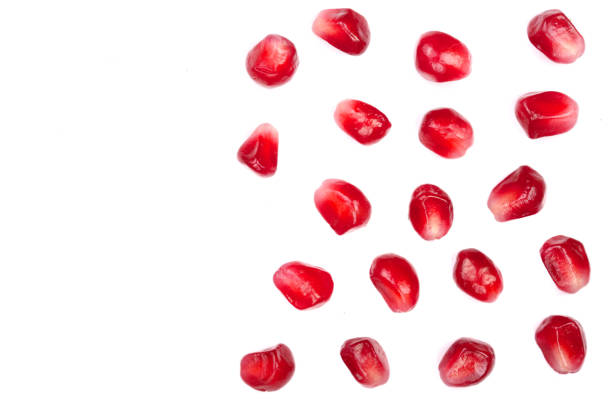 istock pomegranate seeds isolated on white background with copy space for your text. Top view. Flat lay pattern 908596966