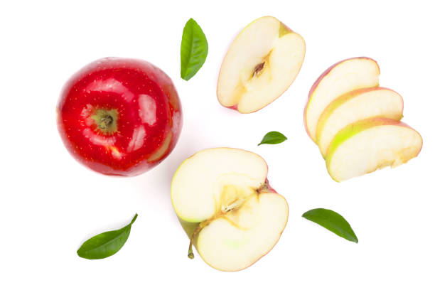istock red apples with slices and leaves isolated on white background top view. Set or collection. Flat lay pattern 908597032