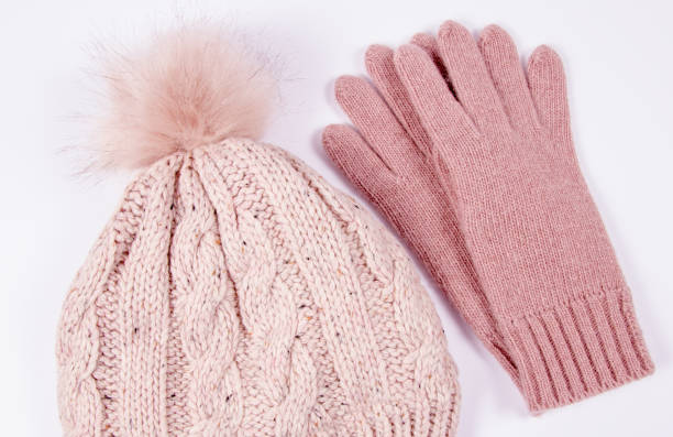 istock Wool hat and gloves for winter weather on a white background. 908597368