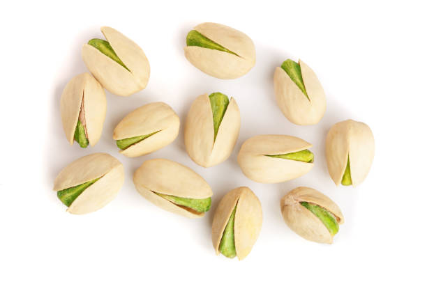 istock Pistachios isolated on white background, top view. Flat lay 908600456