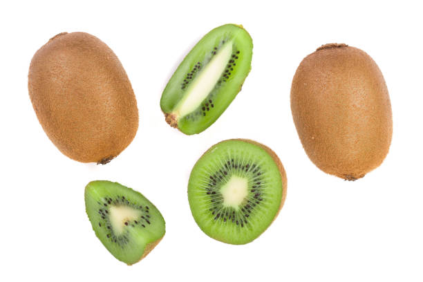 istock Kiwi fruit with slices isolated on white background, close-up. Top view. Flat lay pattern 908600524