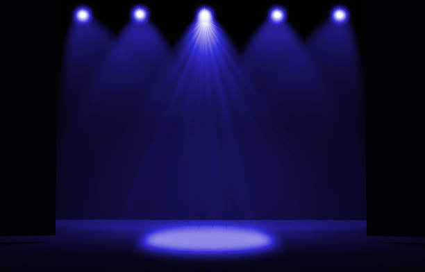 istock Stage lights ,free stage,concerrt stage .Several projectors on the ceiling. Spotlight strike through the darkness to the floor. 908603054