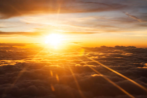 istock Orange Sunrise Betwen Clouds 908603402