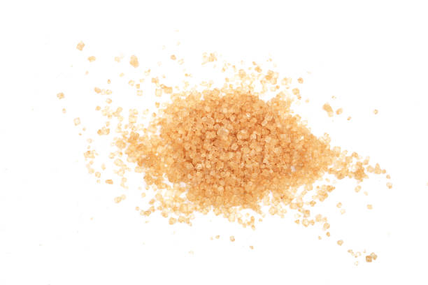 istock brown sugar isolated on white background. Top view. Flat lay 908604674