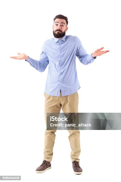 Confused Young Bearded Businessman Shrugging Shoulders Looking At Camera Stock Photo - Download Image Now