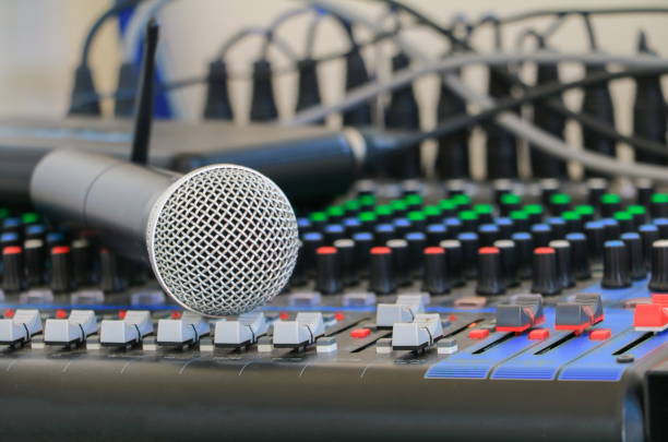 istock Close up of  microphone on sound mixer covered in dust 908610420