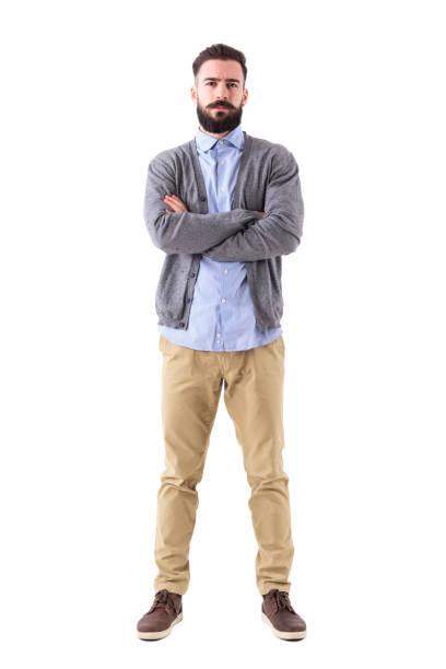 Serious bossy teacher or businessman with crossed arms looking at camera stock photo