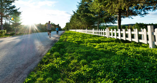 Father and son running in the park