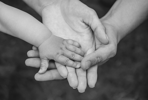 Three Hands Of The Same Family Father Mother And Baby Stay Together Closeup  Stock Photo - Download Image Now - iStock