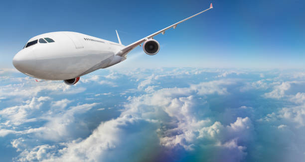 istock Commercial airplane flying above clouds 908618478