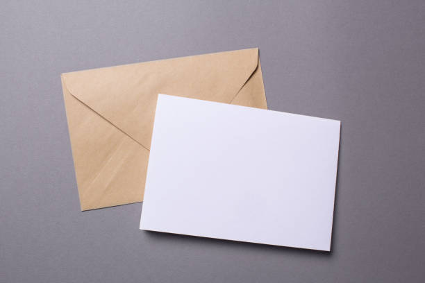 istock Mock-up letter or postcard with envelope on a gray background 908618534