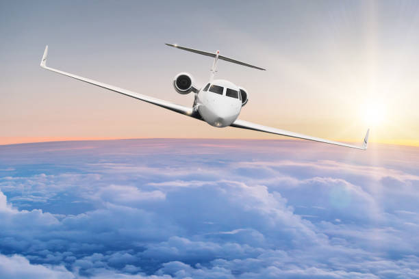 istock Commercial airplane flying above clouds 908618562