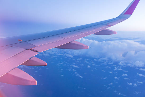 istock SuBeautiful sunset with cloudy sky from the airplane window 908618654