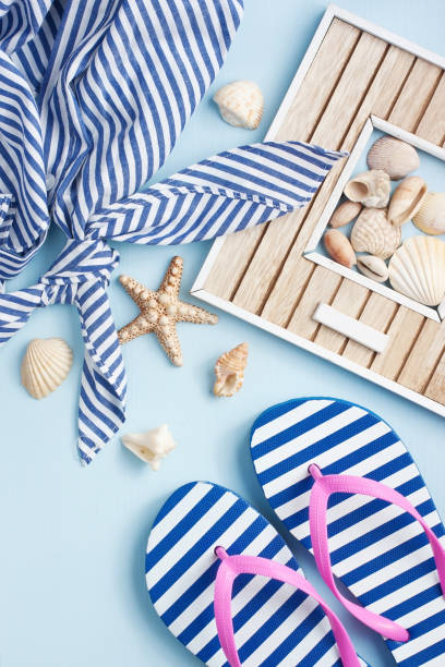 istock Summer accessories on wooden background 908618766