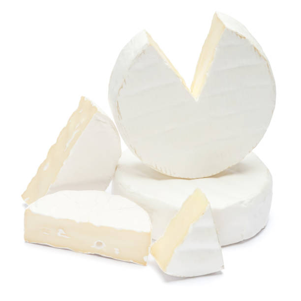 istock Pile of brie or camambert cheese on a white background 908619098