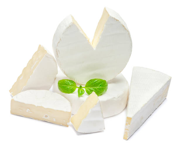 istock Pile of brie or camambert cheese on a white background 908619164