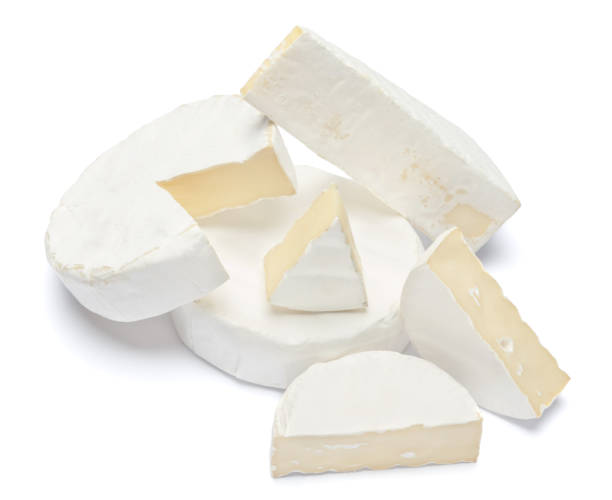 istock Pile of brie or camambert cheese on a white background 908619180