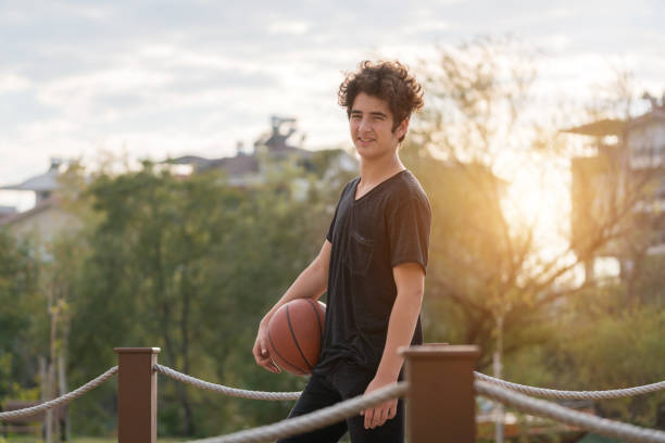 istock Young happy boy having fun at the park 908619740