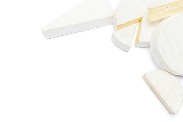 istock Pile of brie or camambert cheese on a white background 908621074