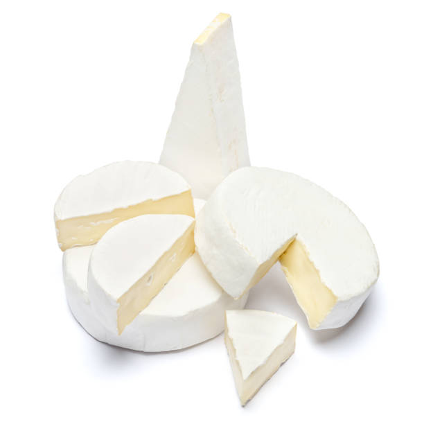 istock Pile of brie or camambert cheese on a white background 908621472