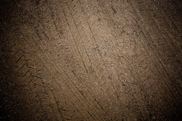 tyre track on dirt sand or mud, retro tone, grunge tone, drive on sand, off road track - mud road tire track footpath imagens e fotografias de stock