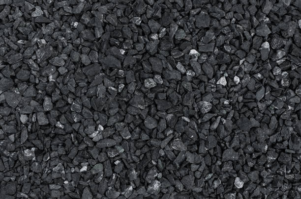 Dark pattern of gravel stone wall texture Dark pattern of gravel stone wall texture or background hard bituminous coal stock pictures, royalty-free photos & images