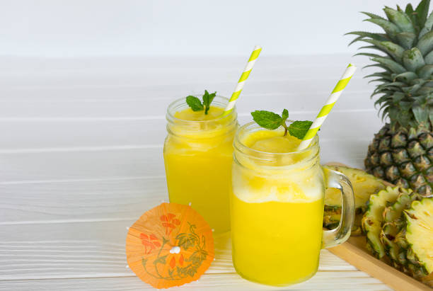 istock pineapple smoothie and pineapple fruits 908635648