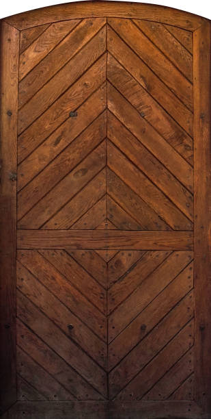 istock Old wooden door in ancient castle 908637102