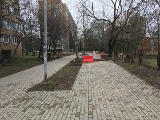 istock repair of sidewalk fencing 908637210