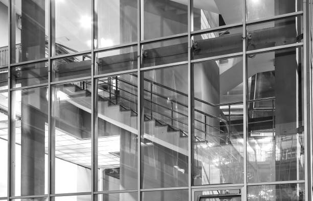 istock Interior of modern glass building with stairs. 908639880