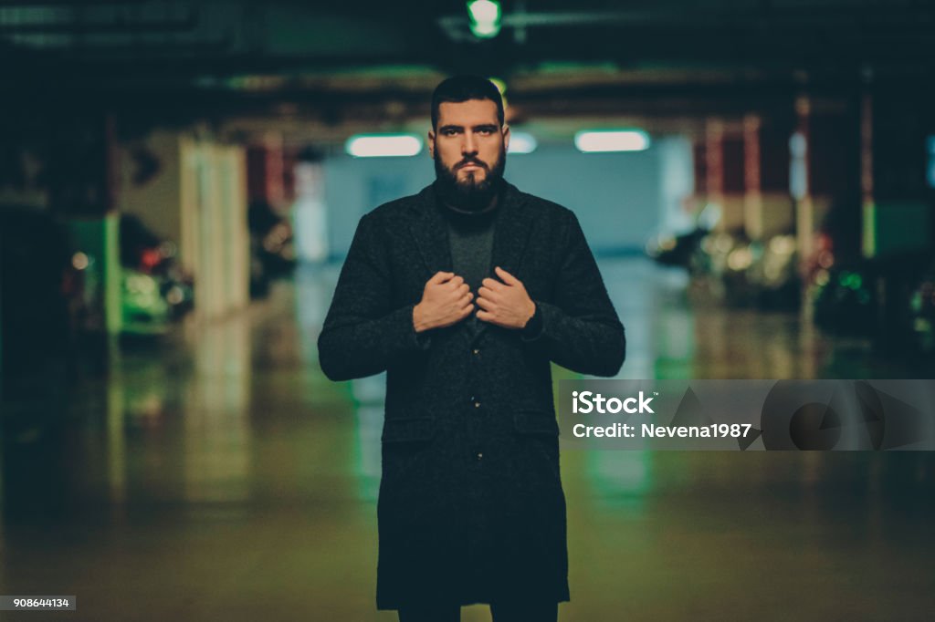 handsome man on a parking at night man,beard,night,hipster,light Manager Stock Photo