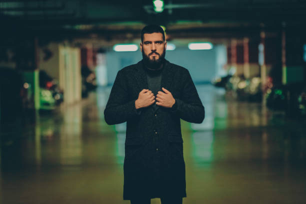 handsome man on a parking at night man,beard,night,hipster,light mafia boss stock pictures, royalty-free photos & images