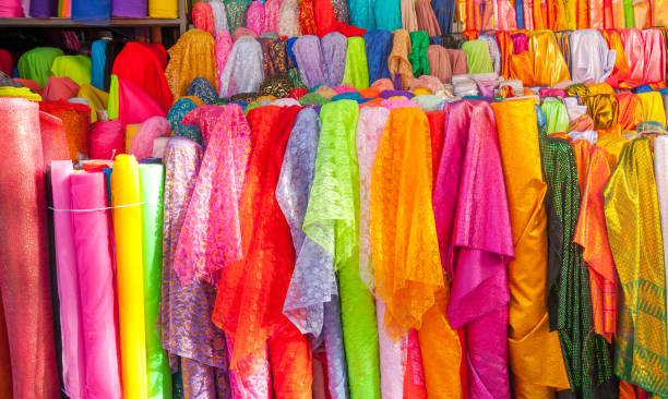 istock Rolls colorful of brightly coloured fabrics and cloths store 908646554