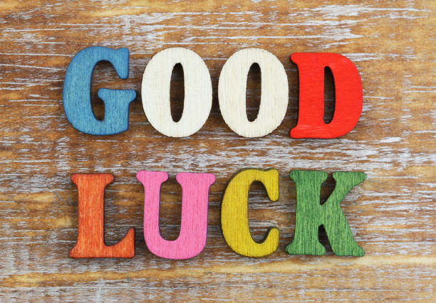 istock Good luck written with wooden letters on wooden surface 908647128