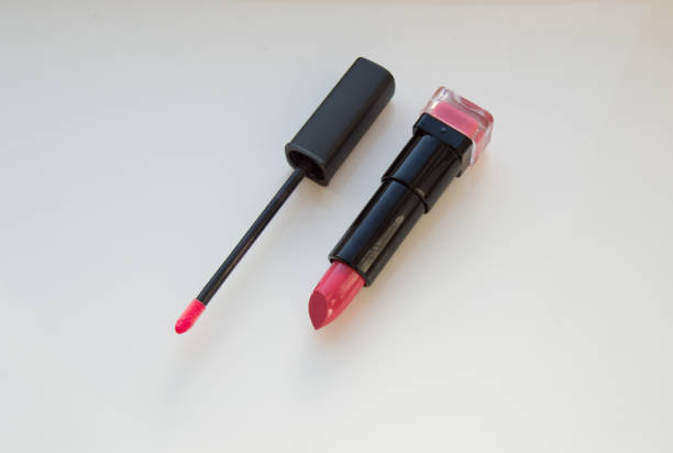 istock brush for lipgloss, lipstick red, pink on white background 908651520