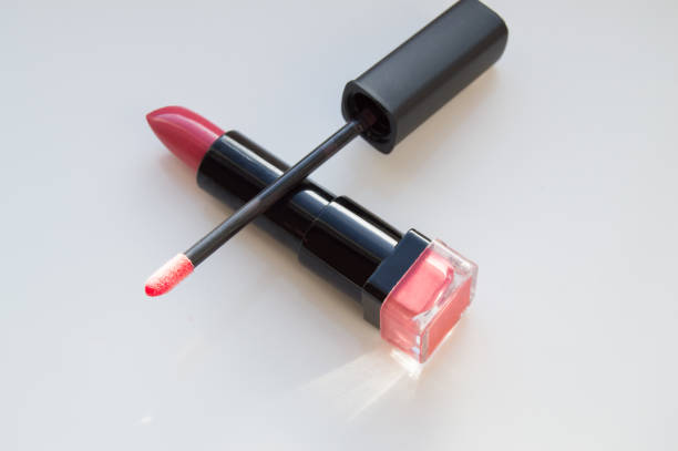 istock brush for lipgloss, lipstick red, pink on white background 908651722