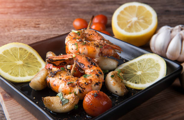 istock Skewers Barbeque grilled prawns with spicy ingredients. 908651810