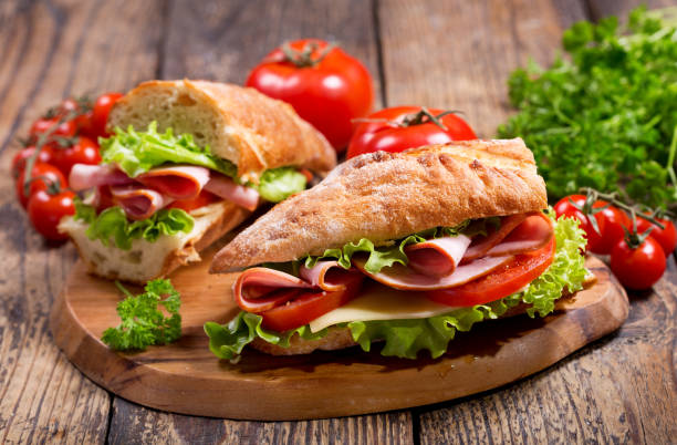 istock two sandwiches with ham and vegetables 908663896