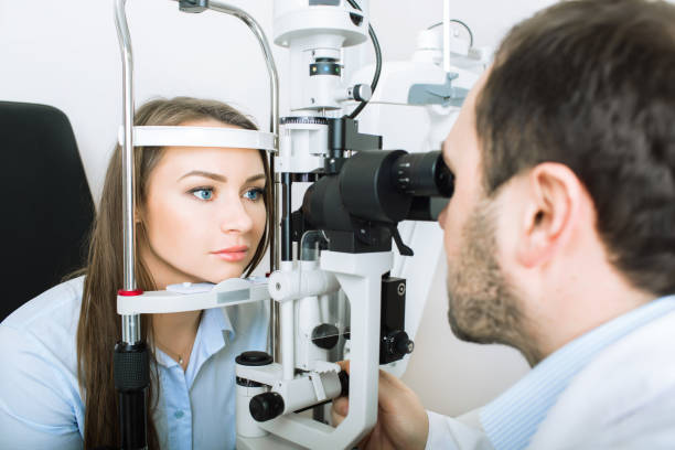 istock woman checking eyesight in clinic 908664370