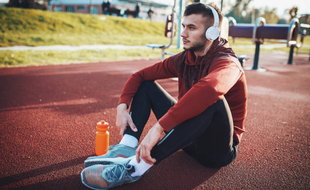 istock Relaxing after training. Sport, fitness, workout concept 908668464